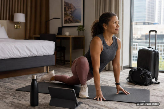 Traveler doing simple bodyweight training and mobility exercises in a hotel room
