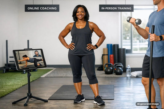 Coach working with a client while comparing online coaching and personal training options
